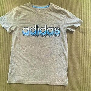 Grey Adidas T-shirt with drippy name in front.         SIZE: Youth LG